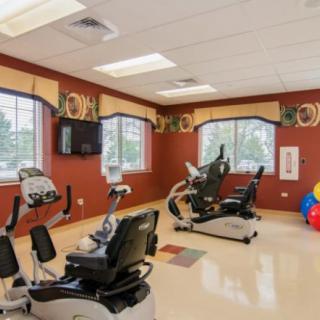 An indoor exercise room equipped with stationary bikes and fitness equipment.
