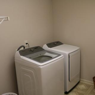A laundry room featuring a washing machine and a dryer.