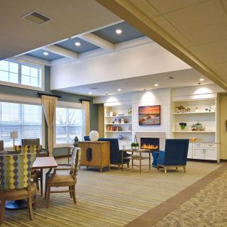 A modern living room with comfortable seating and ample natural light.