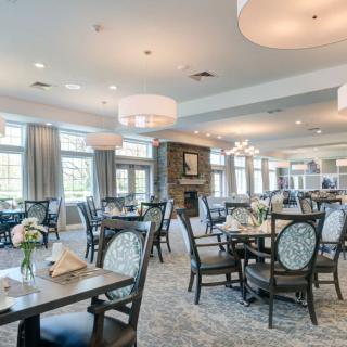Spacious and elegant dining area with modern furnishings.