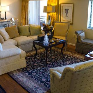 A cozy living room with comfortable seating and elegant decor.