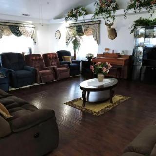 A cozy living room with comfortable seating and a coffee table in the center.