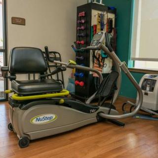 Recumbent stepper machine in a rehabilitation setting.