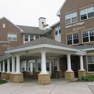 A welcoming entrance to a residential building with a well-designed facade.