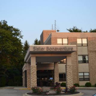 The entrance of a facility named 'Silver Bonaventure' during the evening.