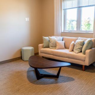 A modern living room with a stylish sofa and coffee table.