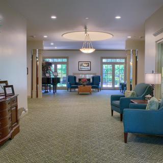 A spacious lobby with comfortable seating and elegant lighting.