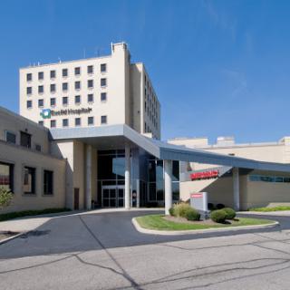 A modern hospital building with a welcoming entrance.