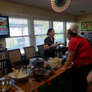 An engaging cooking session with participants sharing tips and recipes.