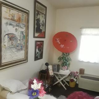 A cozy room featuring artistic decorations and vibrant accents.