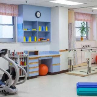 A well-equipped rehabilitation center with therapy equipment and exercise tools.
