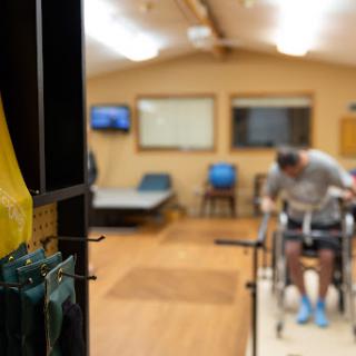A person engaging in physical therapy exercises within a rehabilitation center.