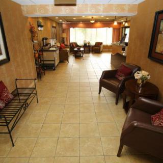A cozy lobby area with seating and warm decor.