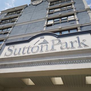 The entrance sign of Sutton Park, showcasing its architectural design.