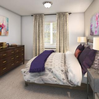 A cozy bedroom with elegant decor, featuring a comfortable bed and stylish furniture.