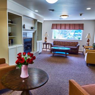 A cozy living room with comfortable seating and a warm, welcoming atmosphere.