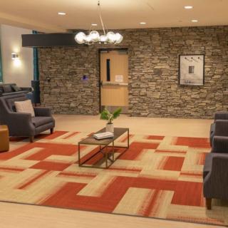 A modern lobby with comfortable seating and stylish decor.