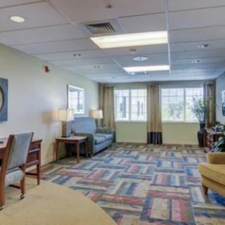 Spacious living area with comfortable seating and large windows.