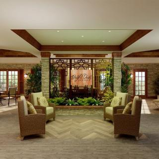 A modern lobby with comfortable seating and decorative plants.