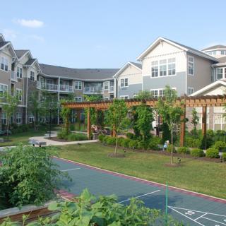 A landscaped garden area surrounded by apartment buildings.
