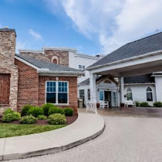 A welcoming view of a beautifully designed building with landscaped surroundings.