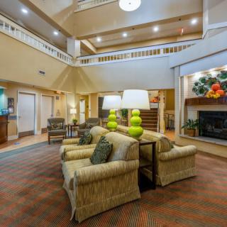Spacious hotel lobby with comfortable seating and modern decor.