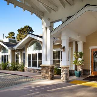The bright and welcoming entrance of a modern building on a sunny day.