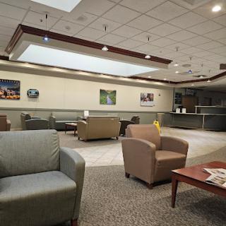 A spacious and modern lobby waiting area featuring comfortable seating and a welcoming atmosphere.