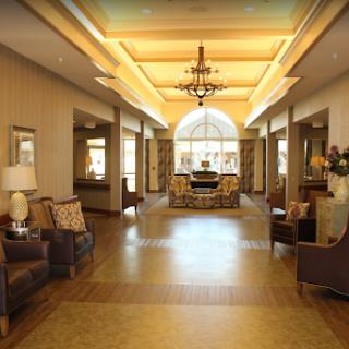 A spacious and elegantly designed lobby with comfortable seating and warm lighting.