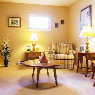 A cozy living room with warm lighting and classic furniture.
