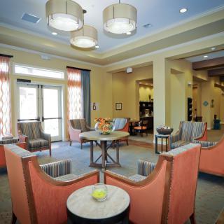 A modern lounge with comfortable seating and stylish lighting.