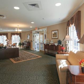 A cozy lobby area with sofas and elegant decor.