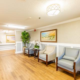 A well-lit waiting room with comfortable seating and stylish decor.
