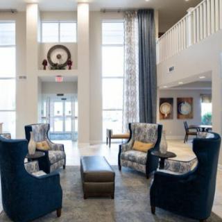A spacious and inviting lobby featuring modern furnishings and a bright, welcoming ambiance.