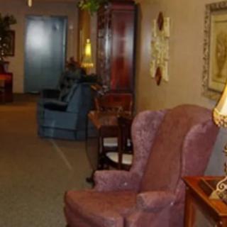 A cozy waiting room with comfortable chairs and warm lighting.
