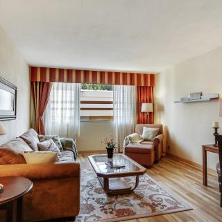 A cozy living room with comfortable seating and warm decor.