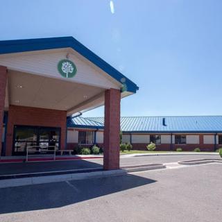 View of a hotel entrance on a clear sunny day.