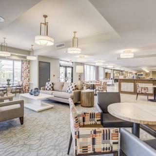 A modern lounge area with comfortable seating and elegant lighting.