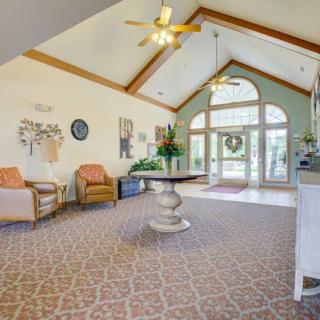 A spacious lobby area with comfortable seating and large windows.