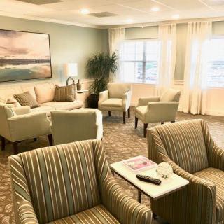 A cozy living room with comfortable seating and elegant decor.