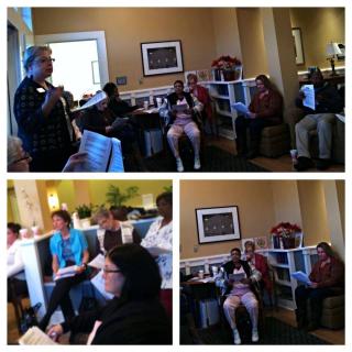 A group of people gathered indoors for a meeting or discussion.
