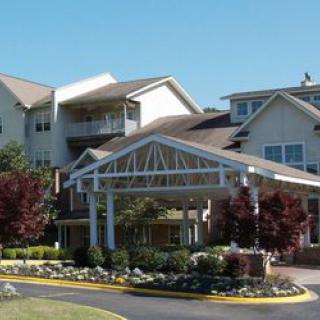 A well-landscaped residential building with a welcoming entrance.
