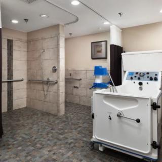 A dialysis treatment room equipped with medical machinery and facilities.