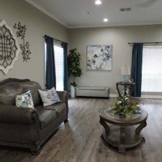 A modern living room with elegant furniture and decor.
