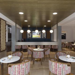 A modern bar and restaurant interior with stylish seating and ambient lighting.