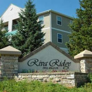 Welcome to River Ridge Apartments, nestled among the trees.
