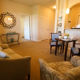 Cozy living and dining area with elegant furniture and decor.