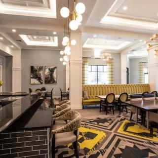 A modern restaurant interior featuring stylish seating and elegant lighting.