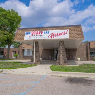 A building showcasing a sign that expresses appreciation for its staff, highlighting their heroic contributions.