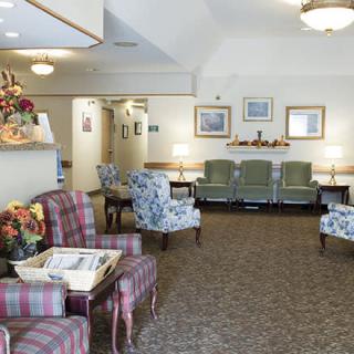 A cozy waiting area with an array of chairs and tasteful decor.